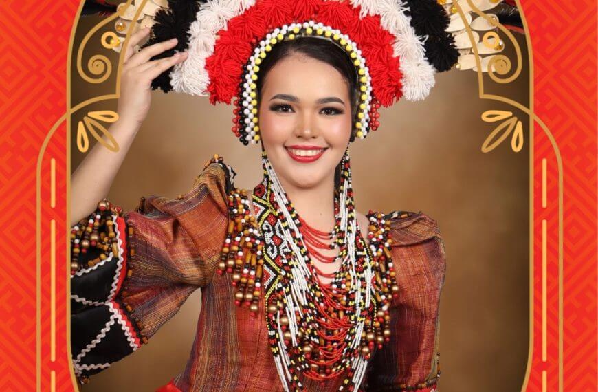 smiling woman in colorful traditional attire and ornate headdress poses for diyandi festival queen 2023.