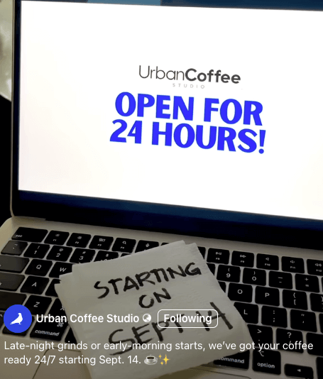 laptop shows "urban coffee studio: 24/7 operations starting september 14!” on the screen.