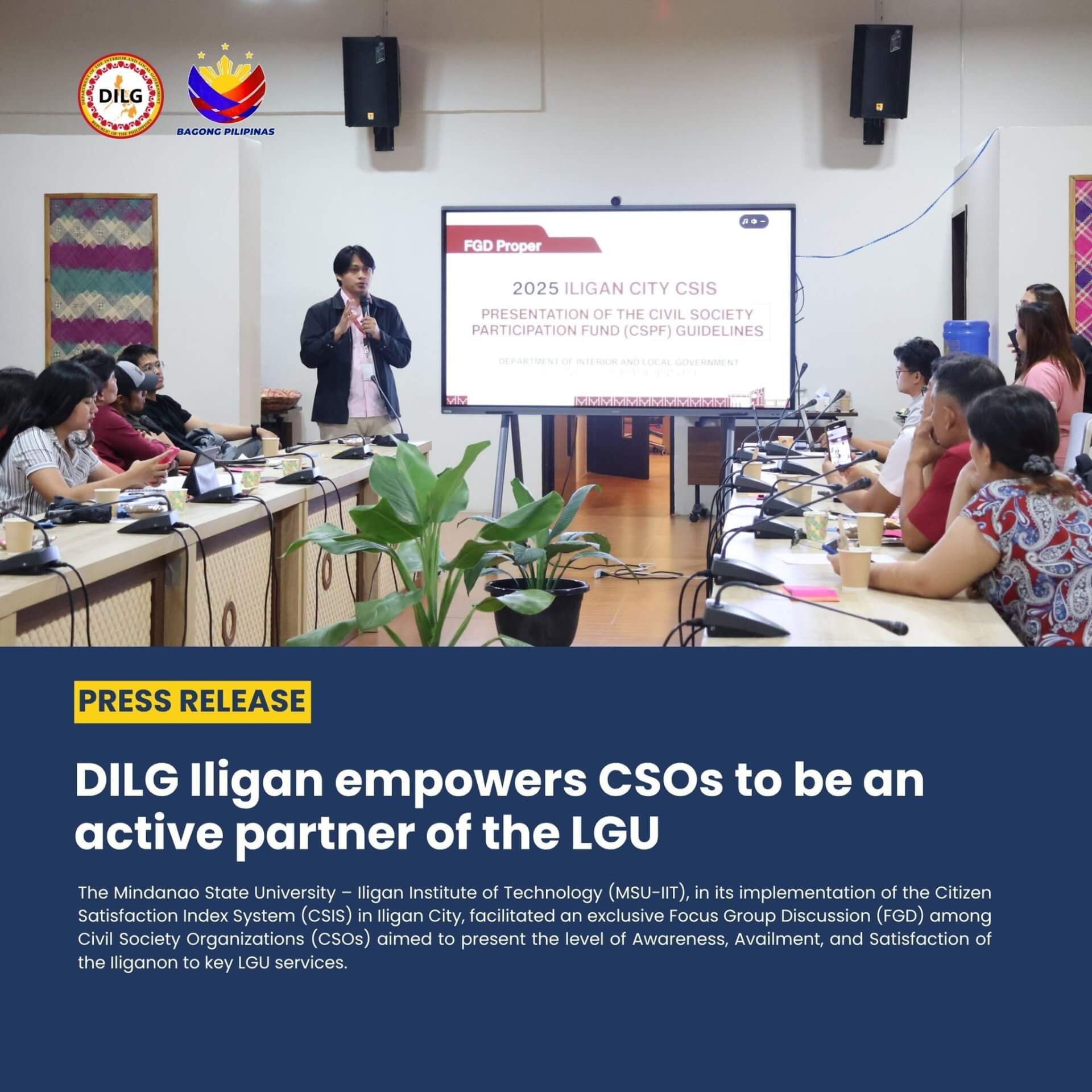 a woman stands and speaks to a group seated in a conference room during a cso partnership meeting.