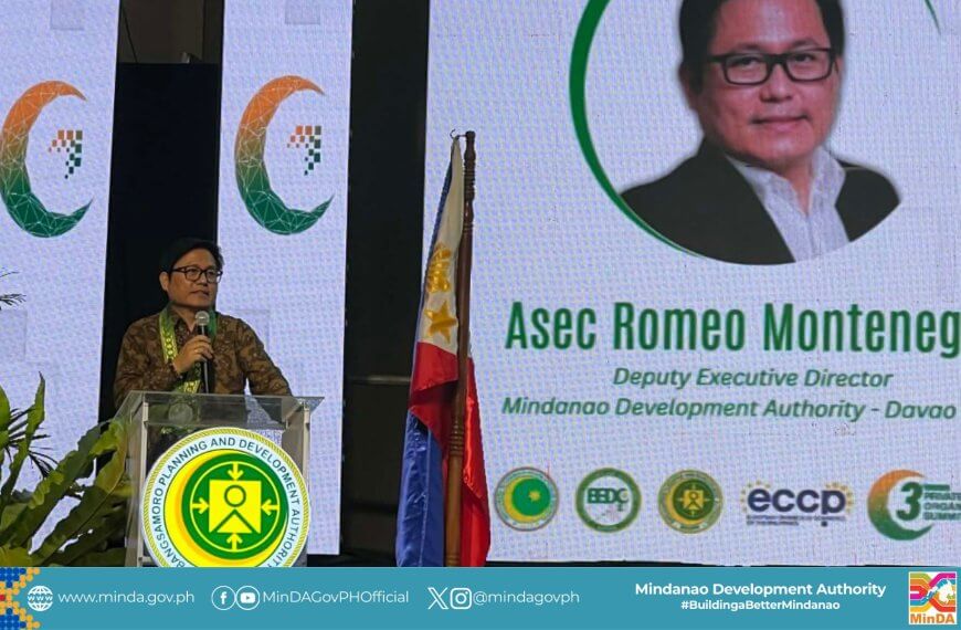 a man speaks at a podium beside a display on asec romeo montenegro’s role in barmm’s inclusive growth.