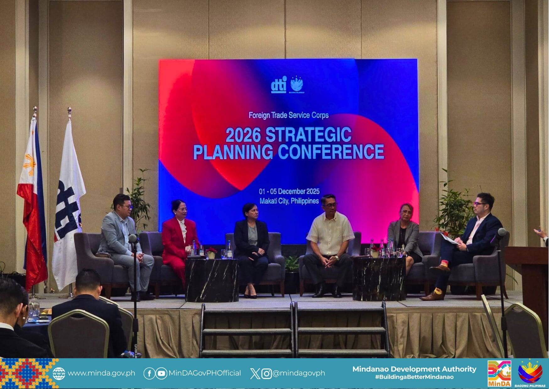 six people discuss agri growth onstage at the 2026 strategic planning conference, with a large screen behind.