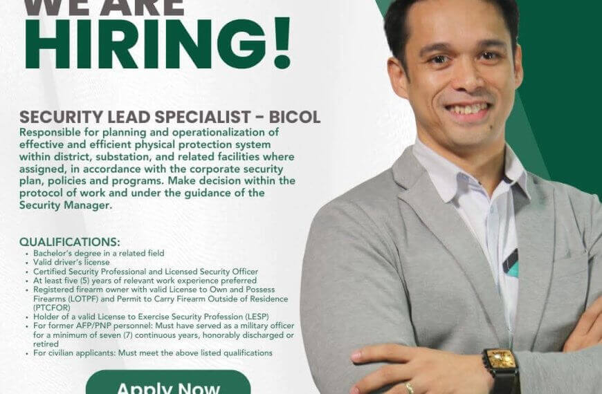 a smiling man in a suit points to a green apply now button on an ngcp security job hiring poster.