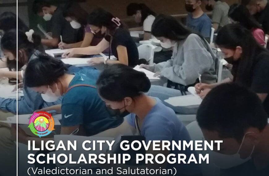 top students wearing masks sit at desks, writing, during the city scholarship program exam in iligan.