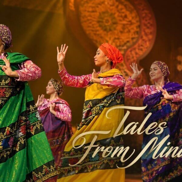 five women in mindanao attire perform a dance on stage with adlaw sa iligan and tales from mindanao overlay.